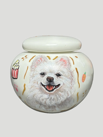 Custom round ceramic cat urn with a hand-painted pet portrait