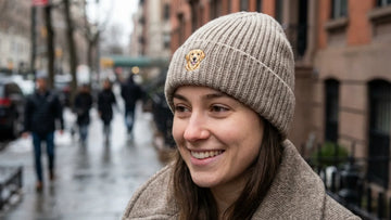 Woman wearing a cuffed rib-knit watch-cap beanie with a small pet portrait patch, winter street style
