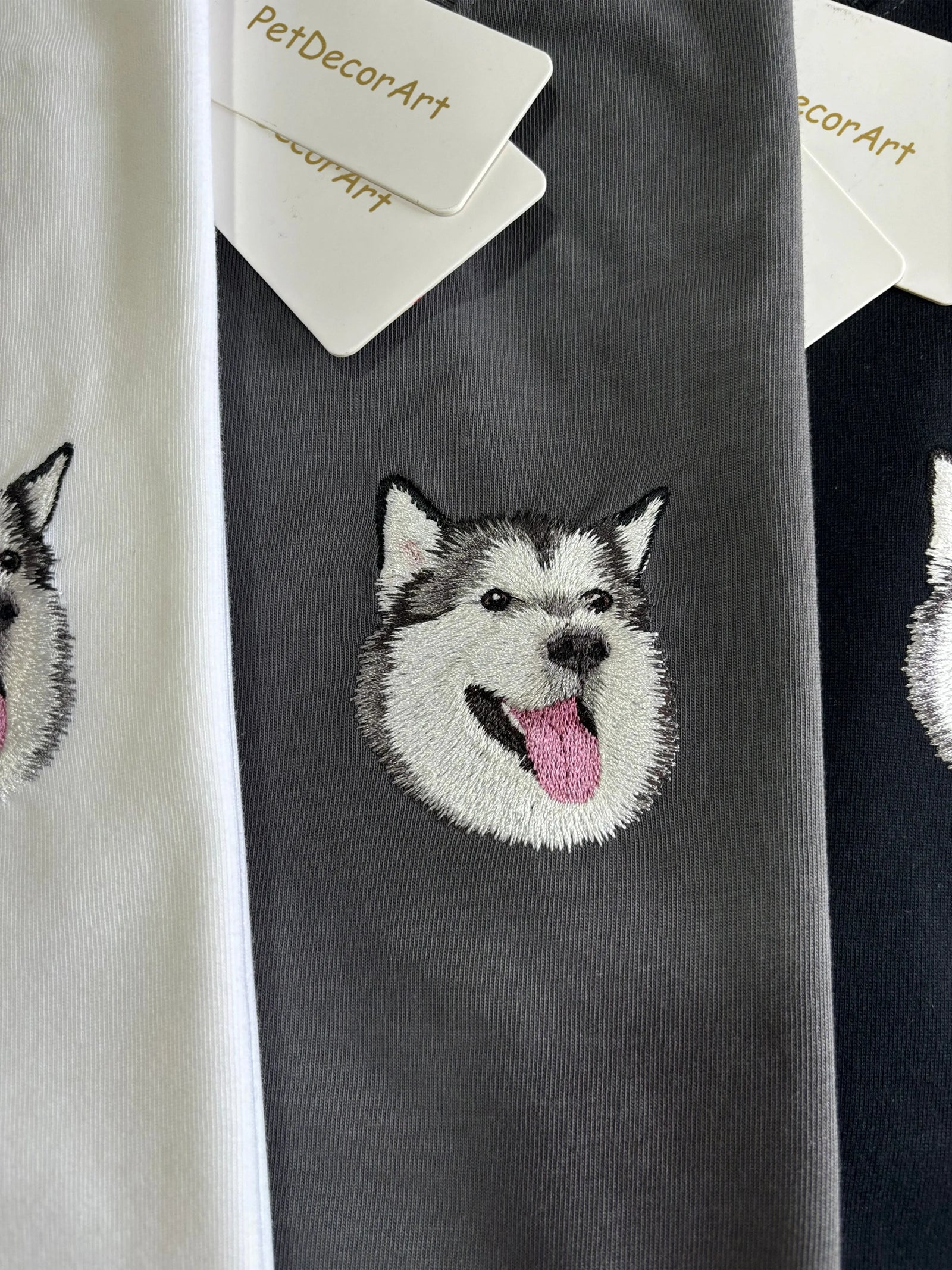 Custom hand embroidered pet portrait t-shirt from PetDecorArt with detailed dog face embroidery