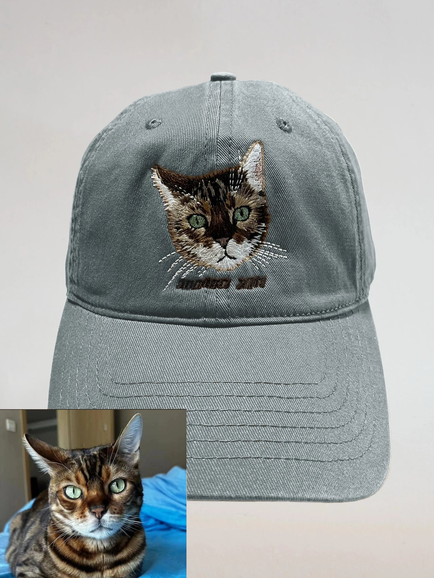 Gray adjustable cap with a custom embroidered cat portrait and reference photo